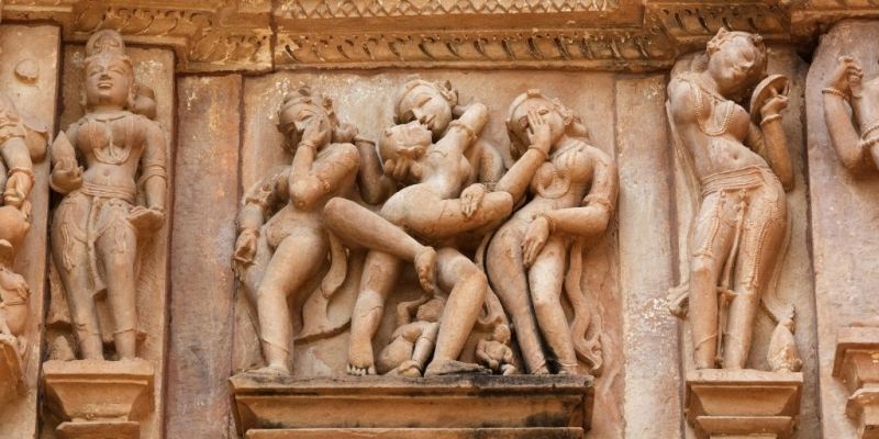Ancient erotic statues carved into wall