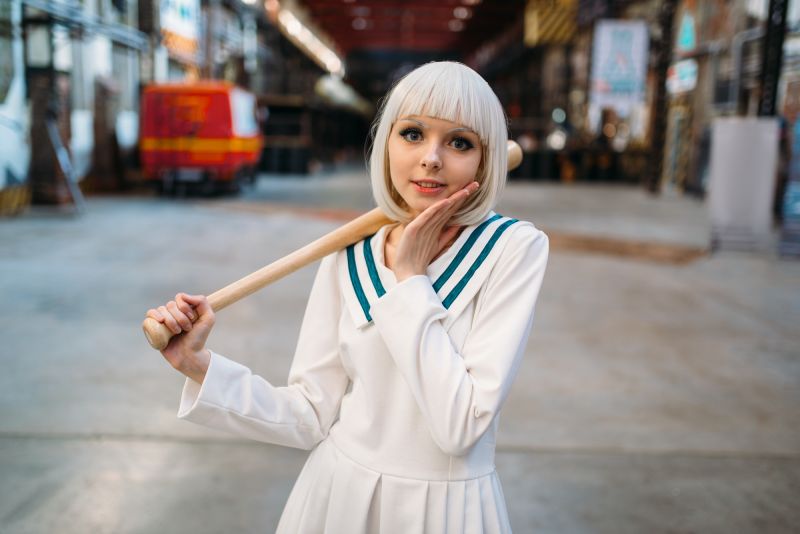 Blonde woman in anime cosplay costume