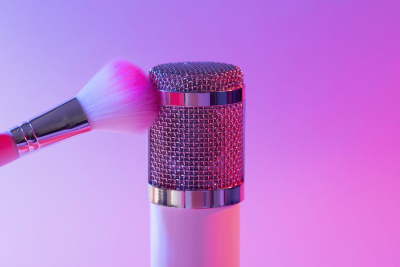 ASMR microphone with make up brush pink background