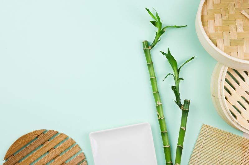 Bamboo sticks and other bamboo products on table