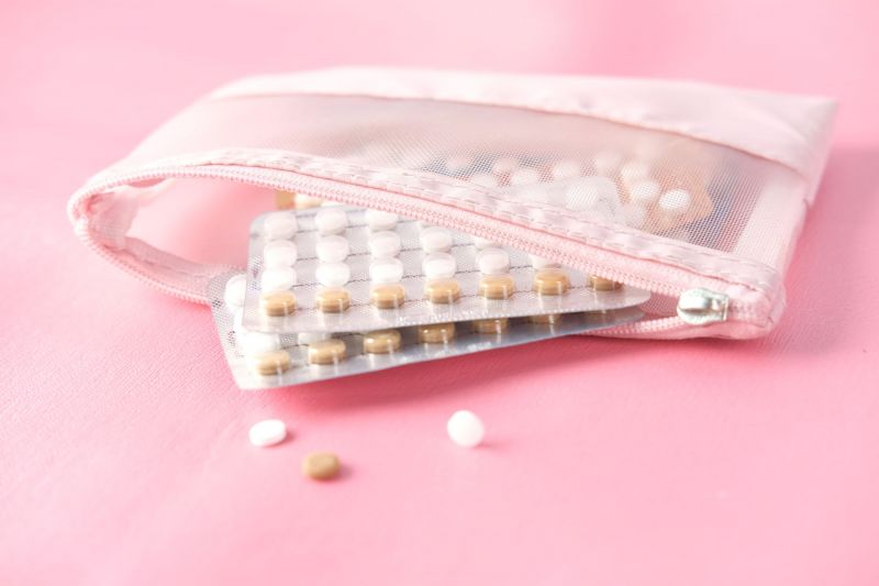 Birth control pills in pink bag
