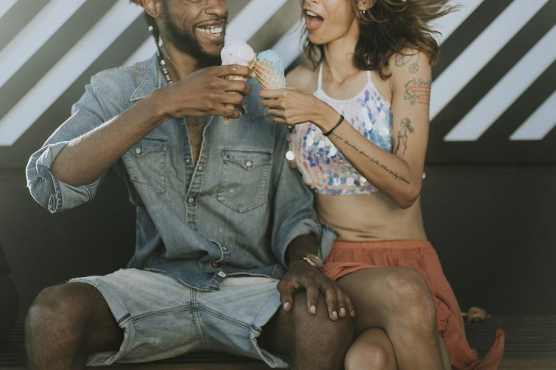 Cheerful couple enjoying ice cream