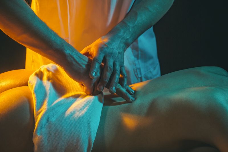 Close up man giving woman message back rub