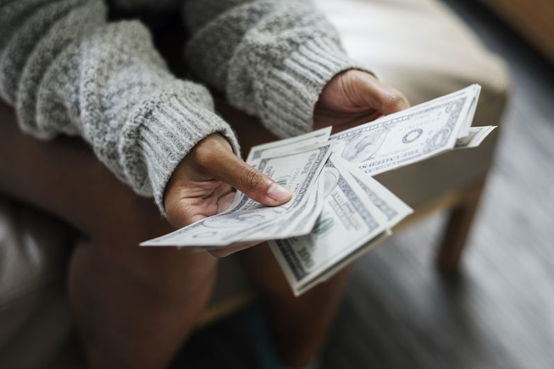 Close up of woman counting money