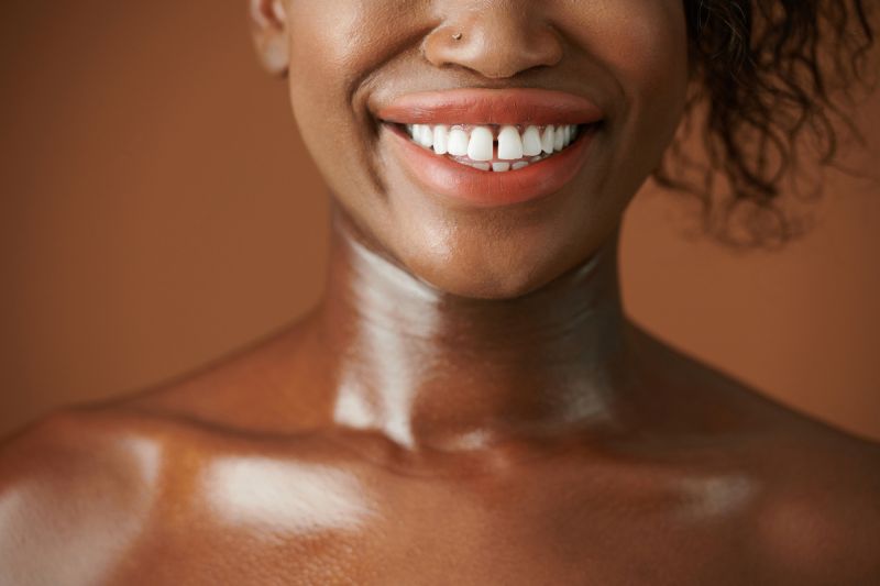 Close up woman smiling with naked shoulders