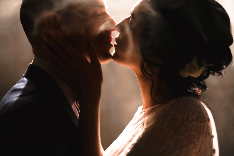 Couple kissing in smoke background