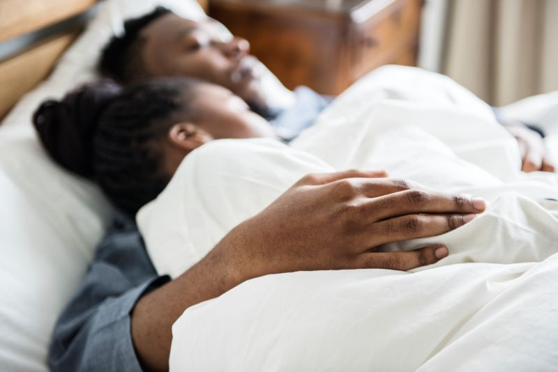 Couple sleeping in bed