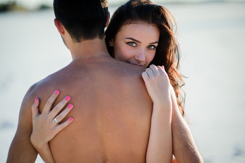 Sexy couple hugging in the beach