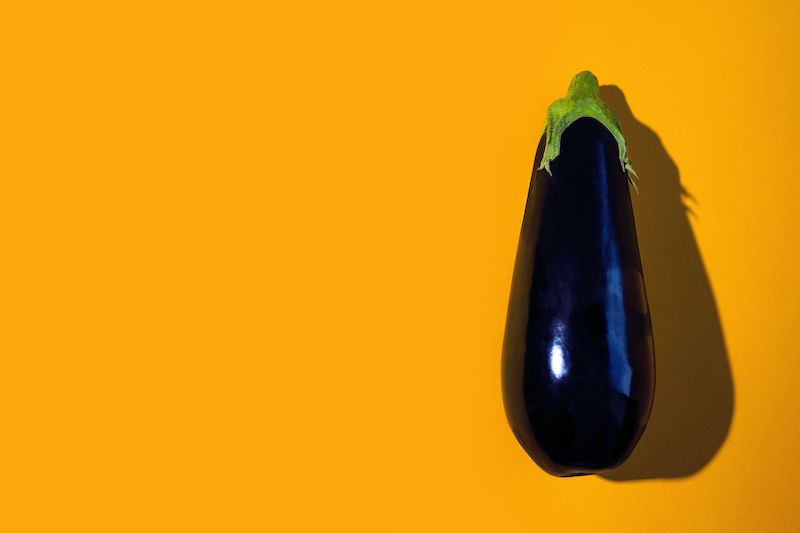 Eggplant on yellow background