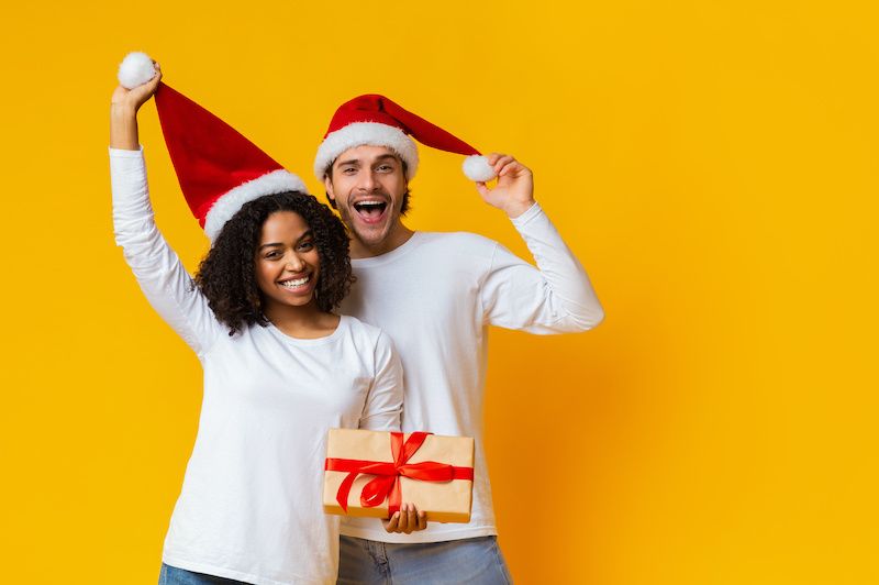 Festive couple on yellow background