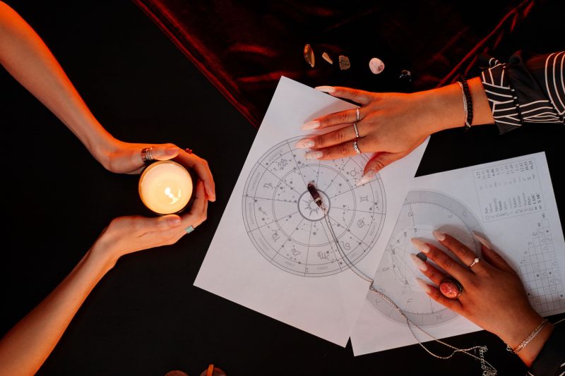 Friends doing astrology reading at home