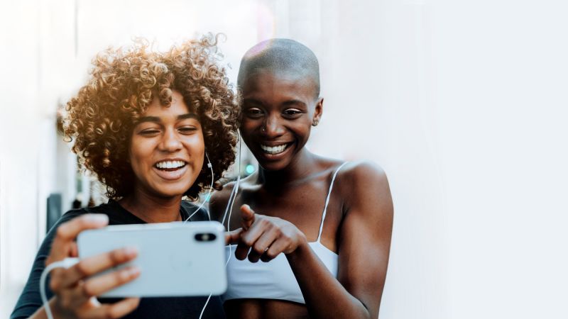 Friends laughing while on video call