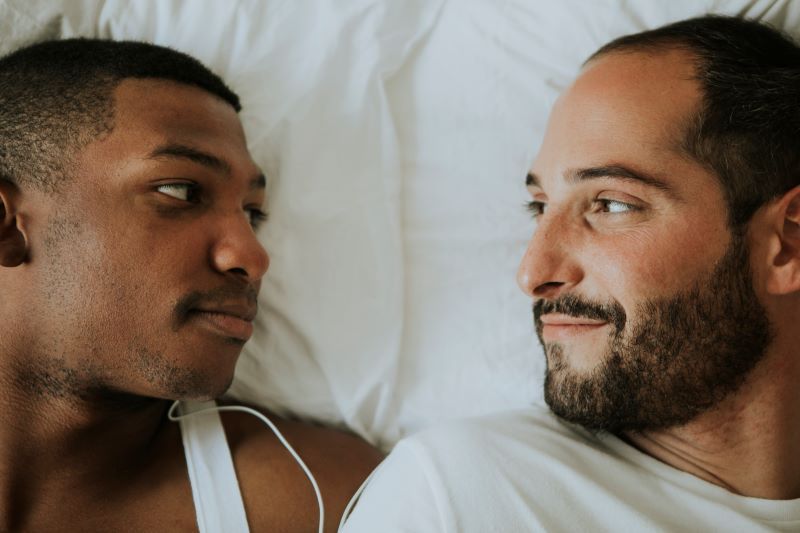 Romantic couple in bed eye contact