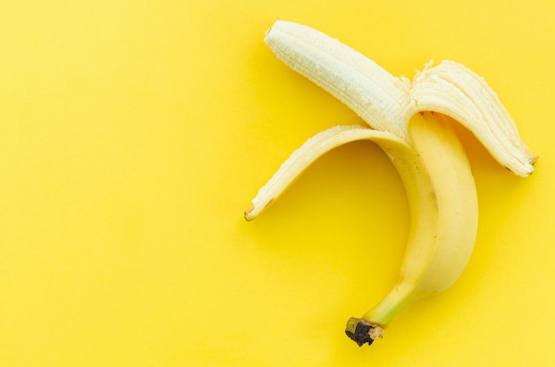 Half peeled banana