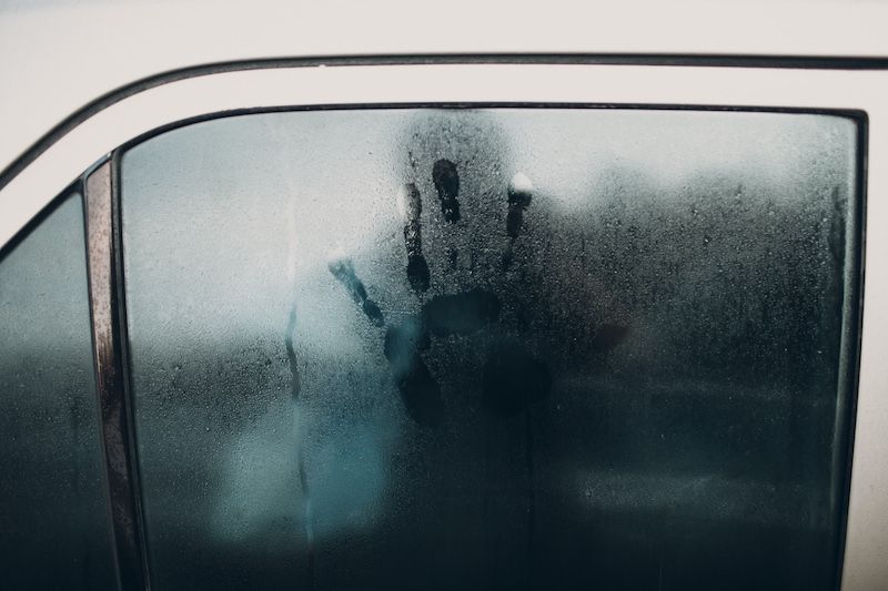 Handprint on a steamy car window