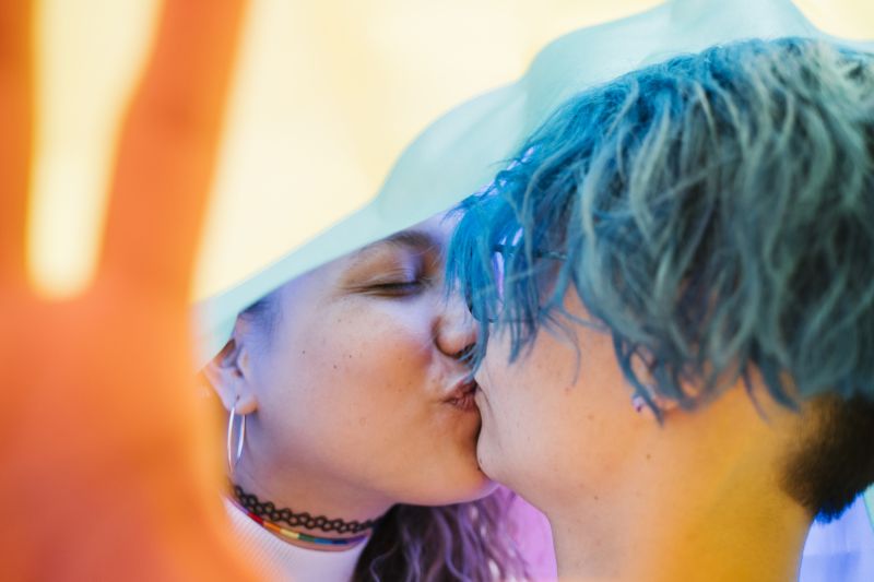 Happy couple kissing under flag