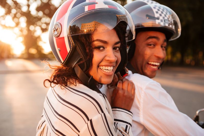 Happy couple on motorbike