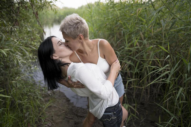 Passionate couple kissing in woods