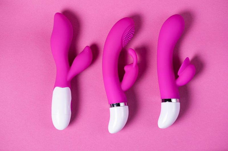 Pink vibrators on pink background