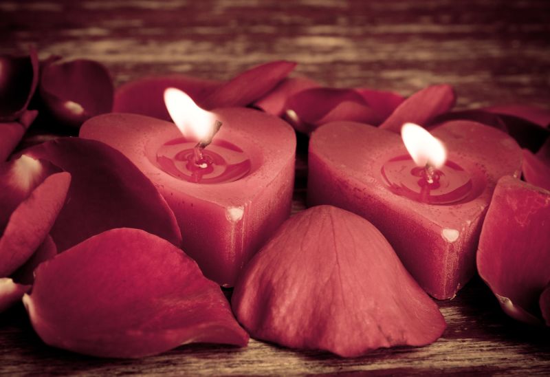 Red romantic candles with red petals