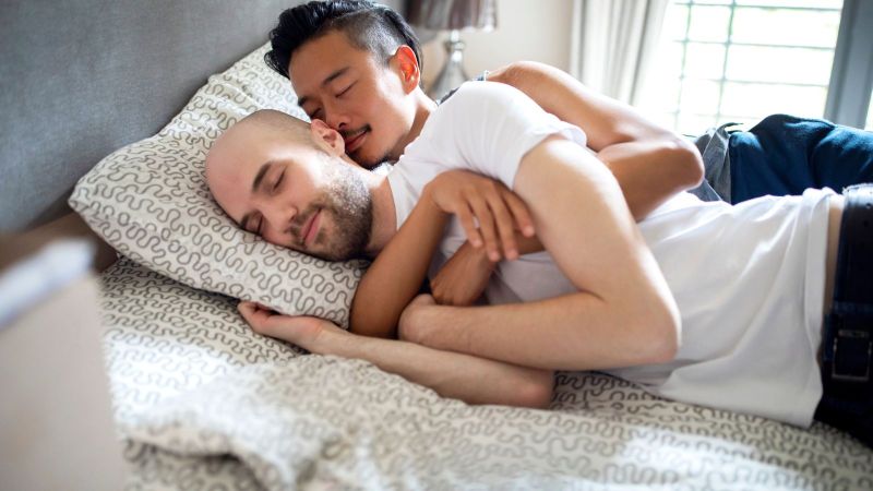 Romantic couple cuddling in bed
