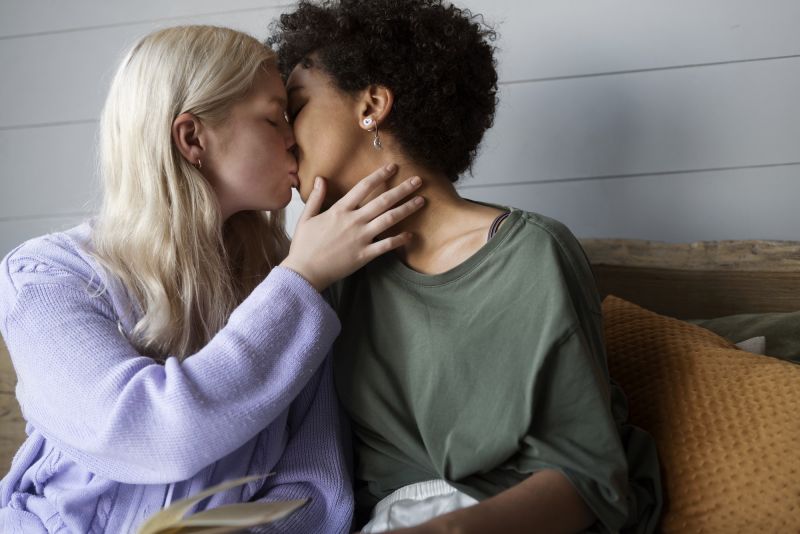 Romantic couple kissing on sofa