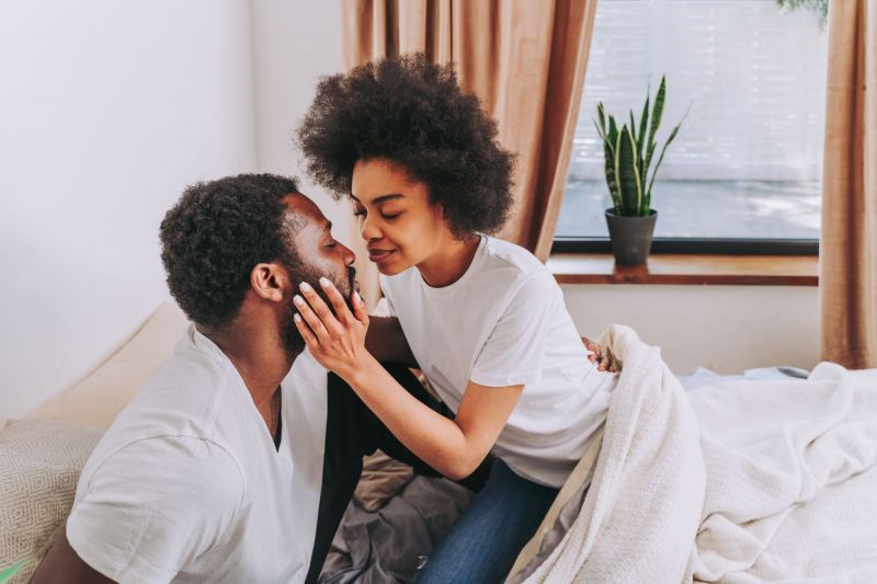 Sensual couple in bed in morning