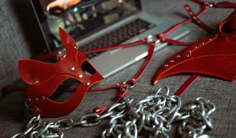 Set of erotic bdsm toys and red mask