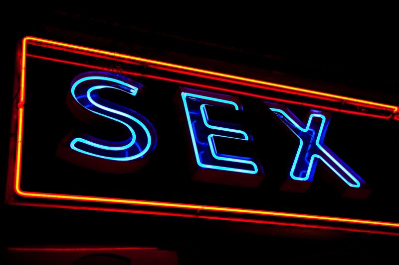 Sex neon sign on black background