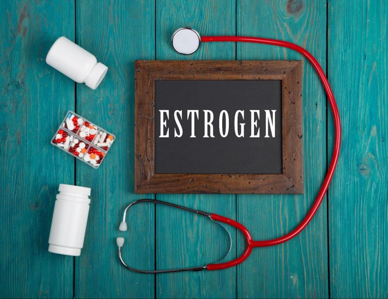 Estrogen sign medication and medical equipment on blue wood