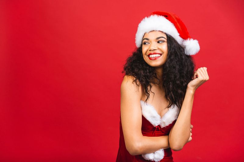 Smiling woman in sexy Christmas outfit
