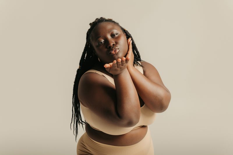 Woman blowing kiss in the camera in lingerie