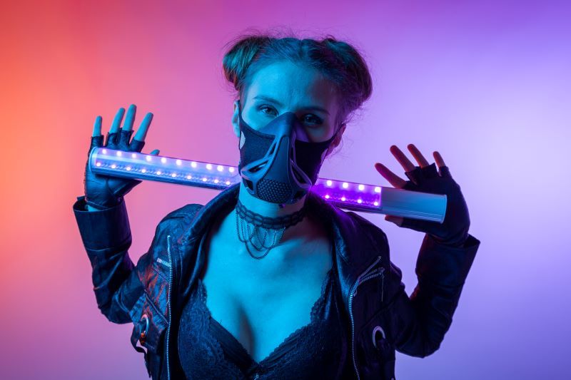 Woman in mask and neon background