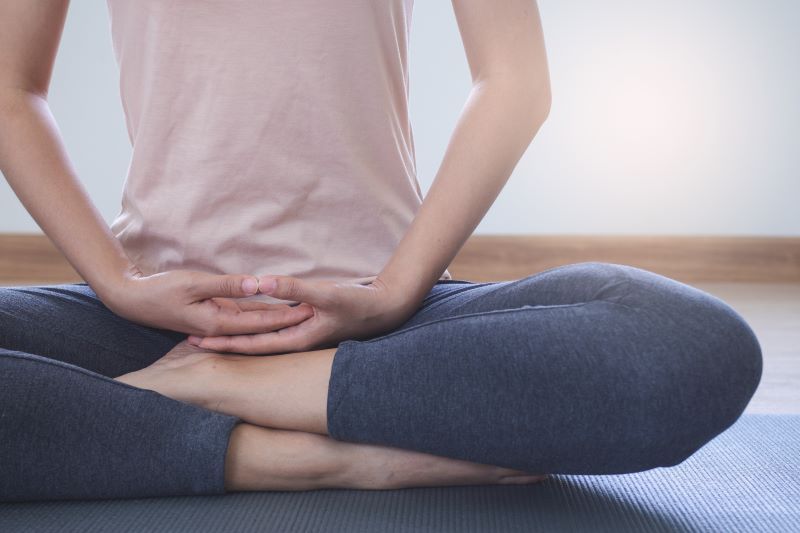 Woman meditating at home