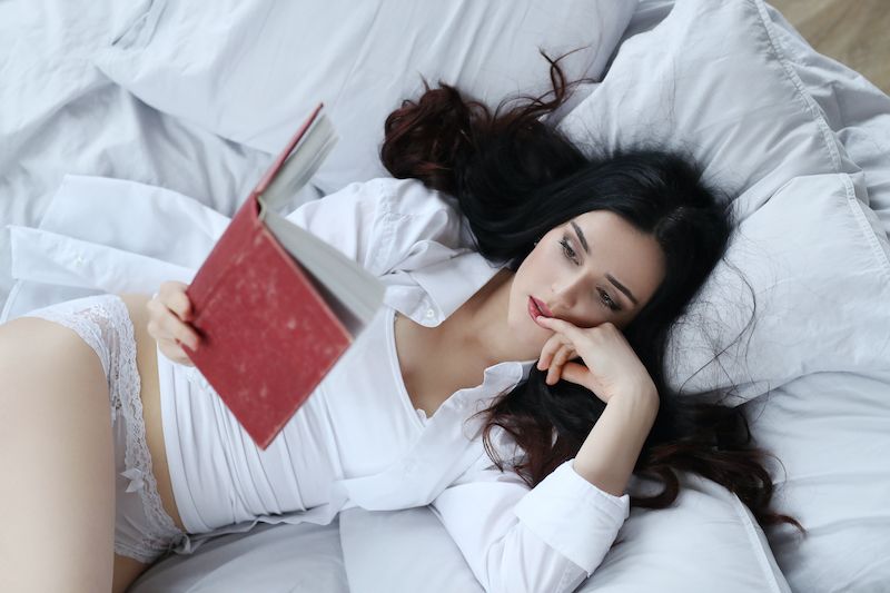 Woman reading in bed