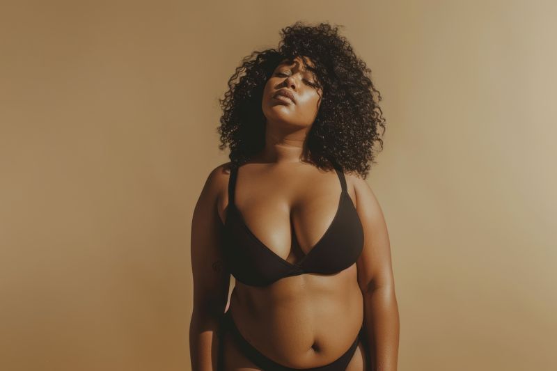 Relaxed woman posing in black bikini