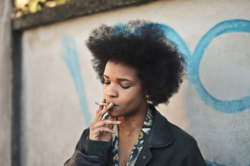 Woman smoking on street