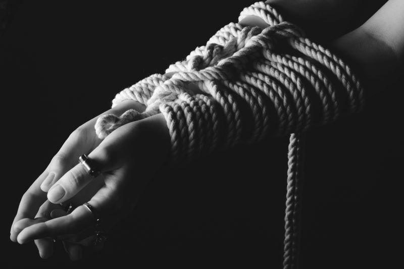 Woman with hands tied kinky