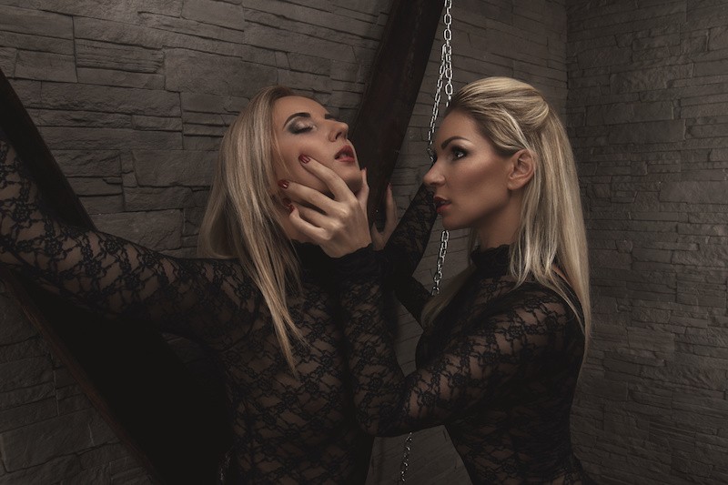 Two women doing a BDSM session