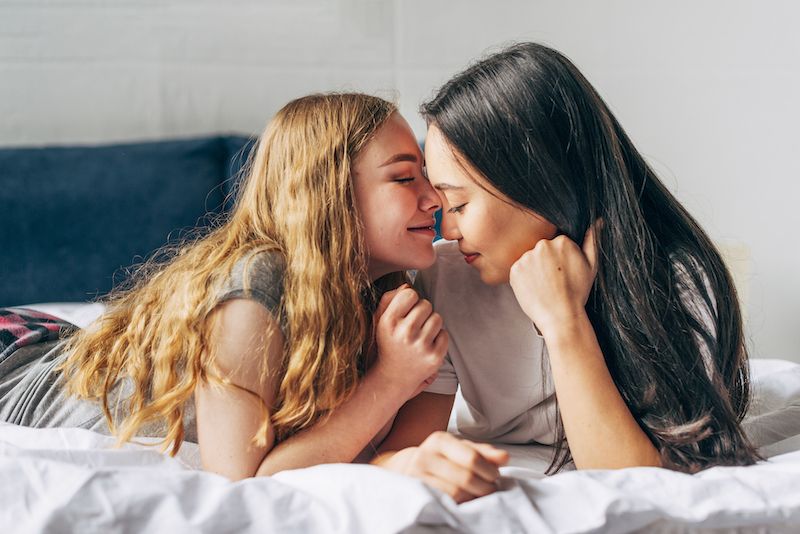 Young couple in bed intimate