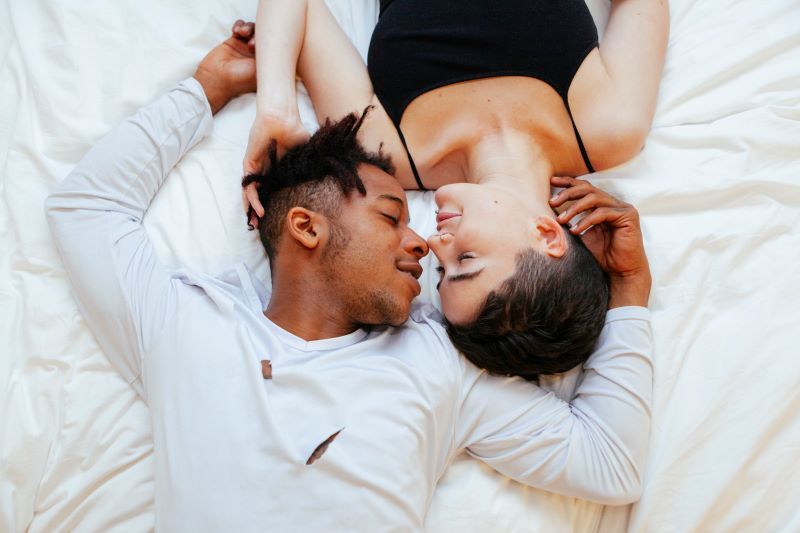 Young romantic couple in bed